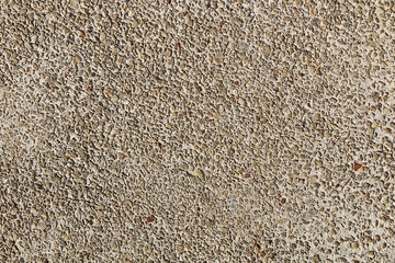 Fragment of a wall of small gravel stones.