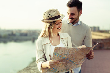 Tourist couple using map as guide