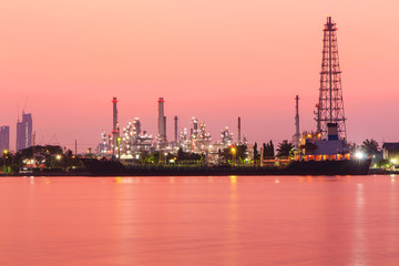 Oil refinery at the river in sunrise time / Big Factory in sunrise time