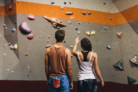 Man and woman at an indoor rock climbing gym