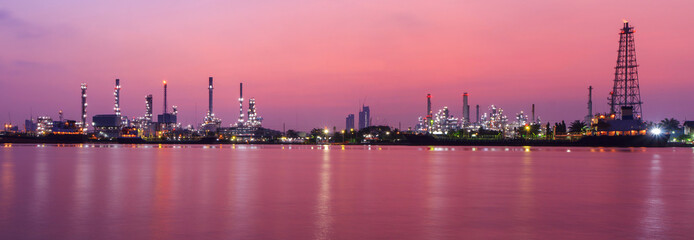 Fototapeta na wymiar Panorama Oil refinery at the river in sunrise time / Big Factory in sunrise time