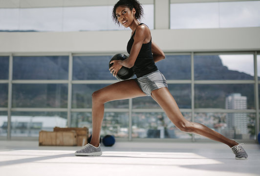 Fitness woman working out with medicine ball