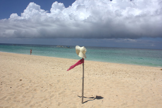 hat, scarf on the beach the island Borakay Filippiny