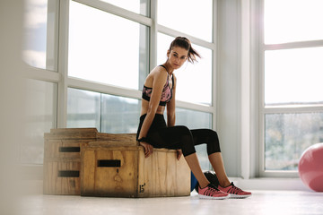 Fototapeta premium Female taking rest after fitness training