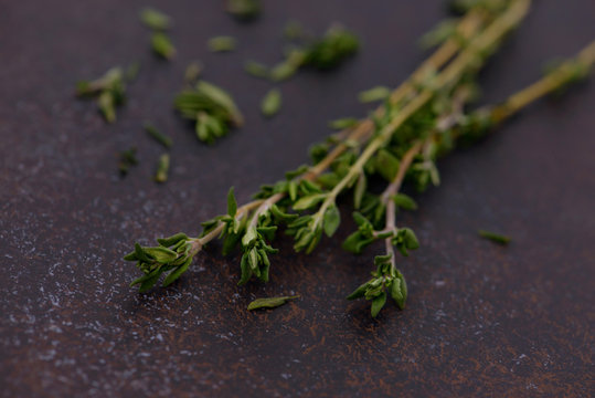 Food background of thyme on kitchen table
