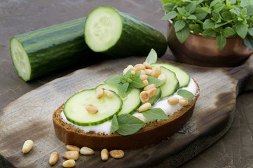 Rye bread with cucumber and pine nuts.