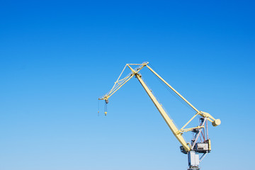 port crane against the blue sky