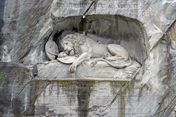 Dying Lion monument on the stone in luzern. (Lowendenkmal) 
carved in the rock to honor Swiss Guards who were massacred during the French Revolution when revolutionaries stormed the Tuileries Palace.