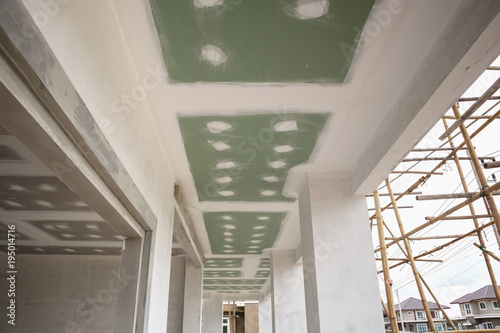 Ceiling Gypsum Board Installation At Construction Site