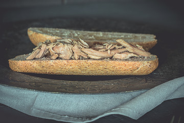 Tuna tuna sandwich with whole wheat bread, healthy food. Black food.