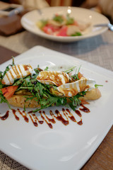 Bruschetta with arugula and cream