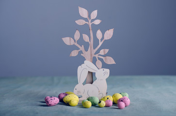 Wooden easter bunnies and chicken eggs
