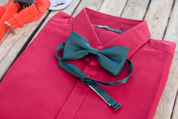 Red shirt and green bow tie