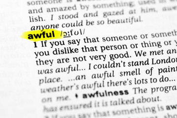 Highlighted English word "awful" and its definition in the dictionary