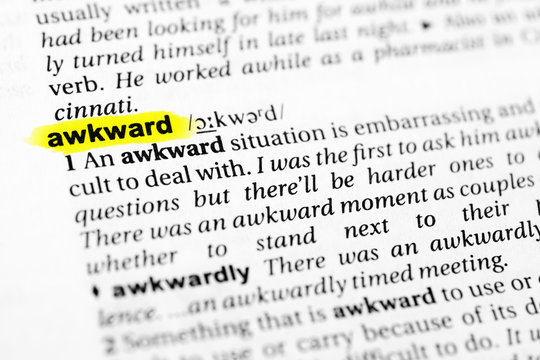 Highlighted English word "awkward" and its definition in the dictionary
