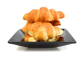 Fresh and tasty croissant over white background 