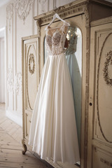 Gorgeous wedding dress on a vintage wardrobe