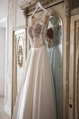 Gorgeous wedding dress on a vintage wardrobe