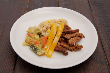 Seitan on the onion and couscous with corn