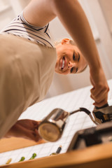 Cheerful pleasant woman working as a barista