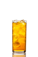 orange drink in a glass on a white background