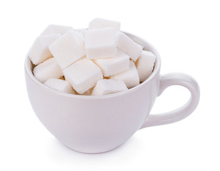 sugar cube in cup on white background