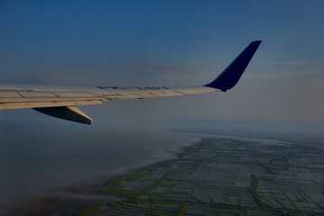Fototapeta premium Blue Sky and Terrain from Airplane