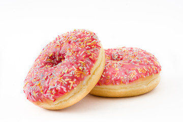 Pink frosted donut with colorful sprinkles. Isolated on white background 
