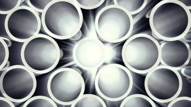 Metal pipes stacked. Heap of shiny metal steel pipes with selective focus effect. 3D animation 4k