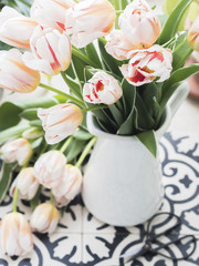 Naklejka na ściany i meble Bouquet of fresh tulips in jug