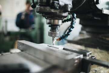 Metallurgy heavy industry. Factory for production industrial machines. Low light close up shot.