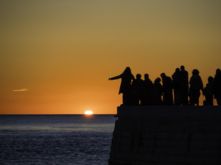 People watching sunset over the Atlantic Ocean