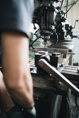 Metallurgy heavy industry. Factory for production industrial machines. Low light close up shot.