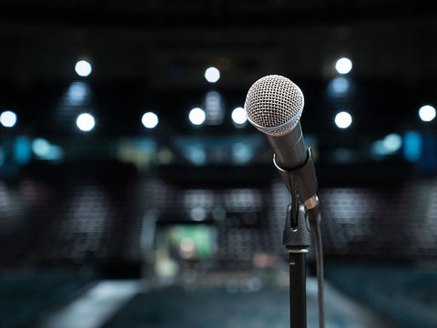 Microphone close-up in empty auditorium