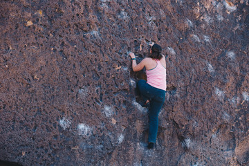 Woman in Pink Tank Top Bouldering outside