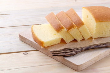 Butter cake on wooden background