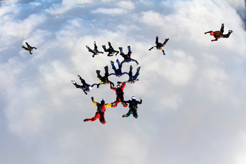 A group of skydivers is in the sky.