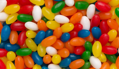 Fototapeta na wymiar Candy backgrounds. Assorted jelly beans, sweet. Colorful image great for backgrounds.