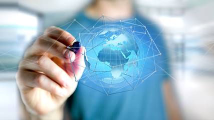 Businessman holding a Connected network over a earth globe concept on a futuristic interface - 3d rendering