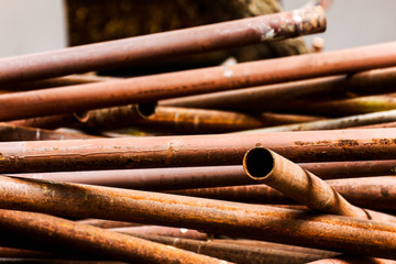 stack of damage rusty metal pipe