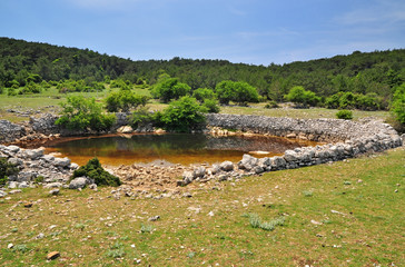 Historic waterhole landscape of Brac Croatia