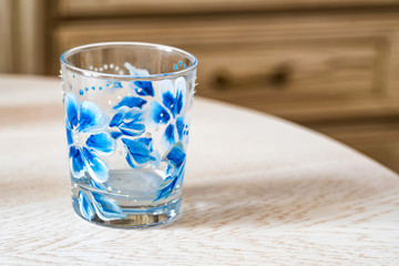 Glass with colorful floral hand painting
