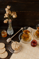 Turkish tea ceremony. Eastern authentic tea time. Breakfast for two people. Cookies, jam, tea, biscuits and rose flowers in a vase on a table cloth. Relaxation.All inclusive room service, Tasty meal