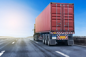 Truck on highway road with red  container, transportation concept.,import,export logistic industrial Transporting Land transport on the asphalt expressway with blue sky