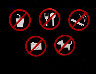Do-not-bring-these-items-into-this-store signage: No drinks, eating, smoking,  photography, or pets icons.