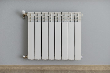 white radiator on the wall with wallpaper gray-blue