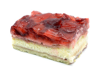 Strawberry cake piece with jelly and quark on isolated white background