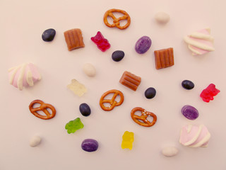Unhealthy food concept. A lot of sweets and candies background. Close up