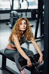 Fototapeta na wymiar Young athletic woman in the gym