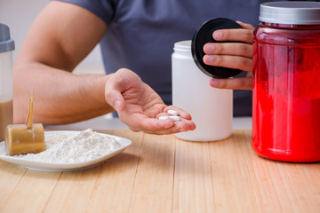 Athlete tasting new protein supplements for better muscles